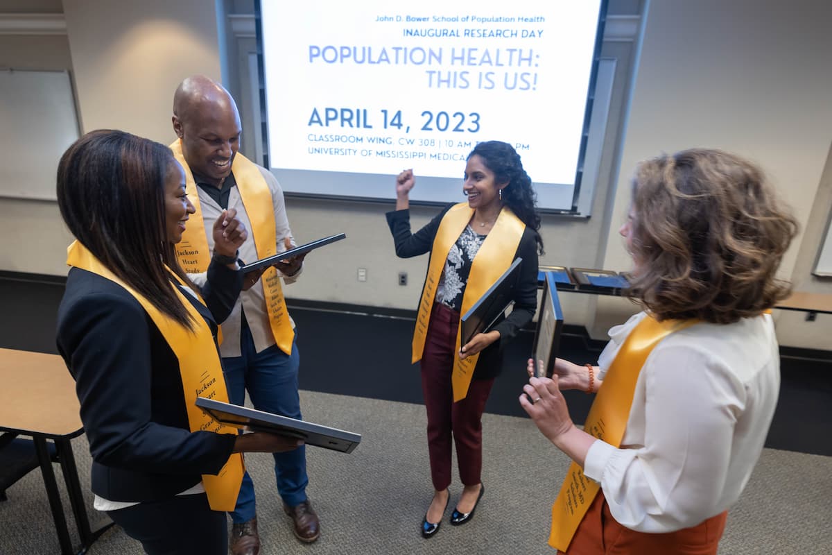 2023 SOPH Research Day - Students standing in a circle at the 2023 SOPH Research Day